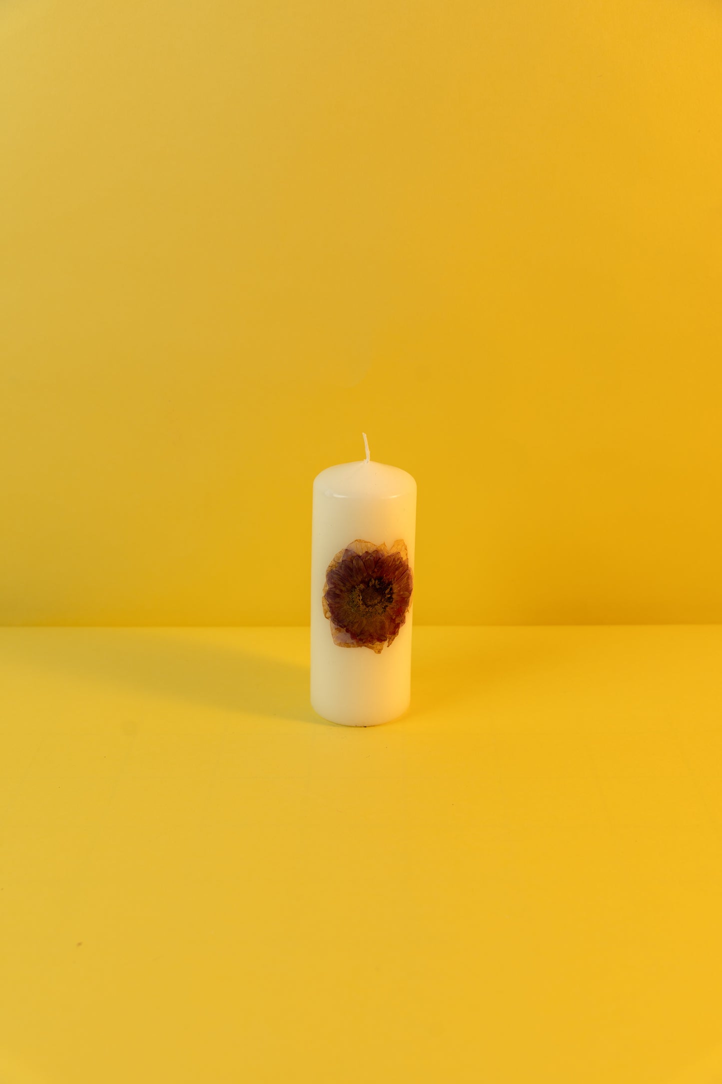 Pillar Candle decorated with dried flowers
