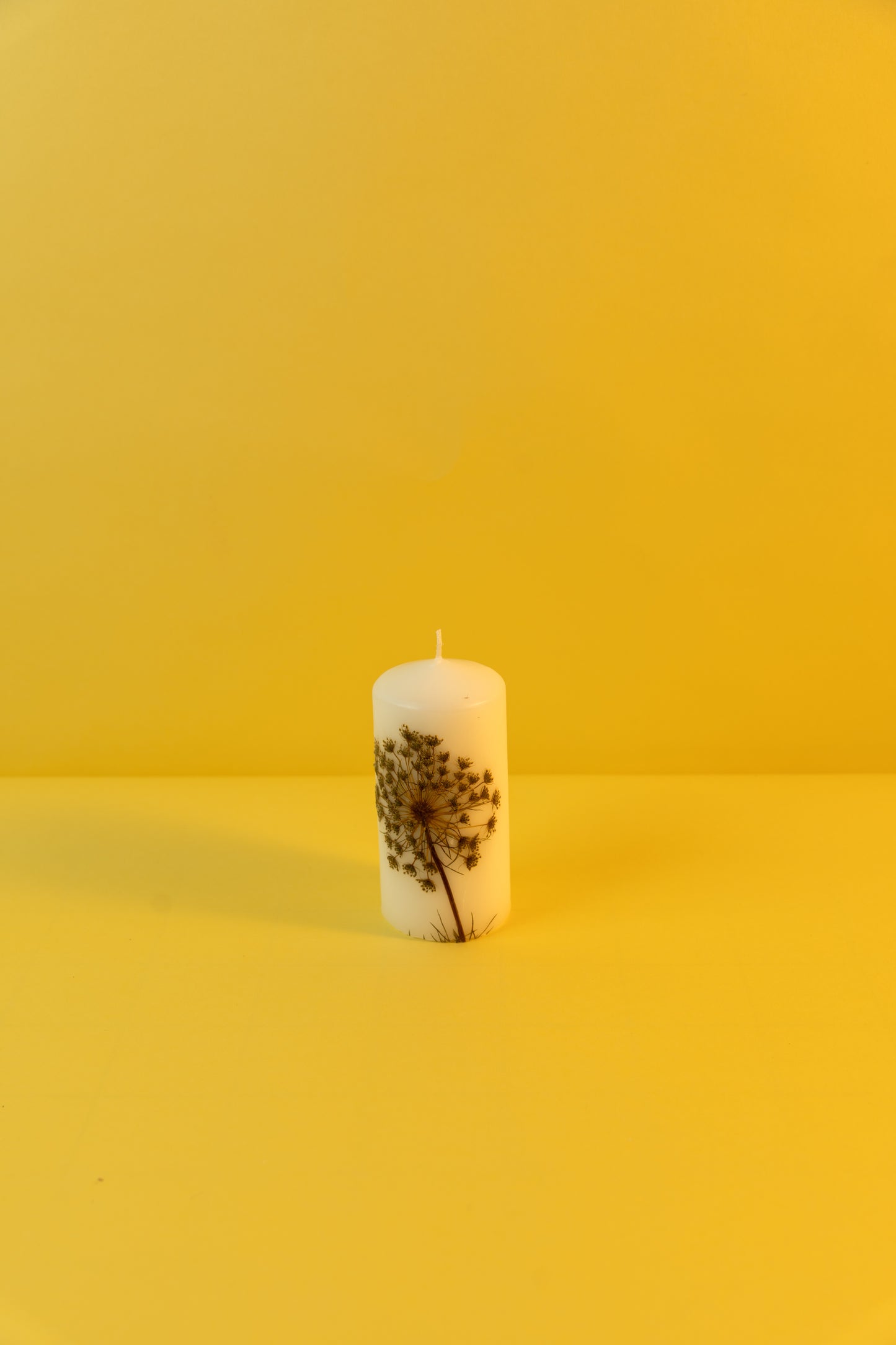 Pillar Candle decorated with dried flowers